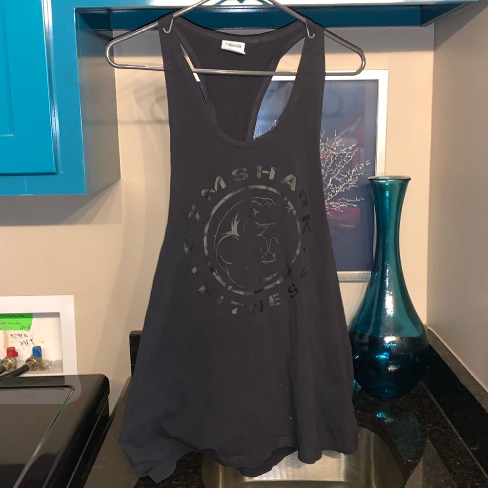 An XL used black cotton/elastane women’s Gym Shark shirt.  Has some logo wear.
